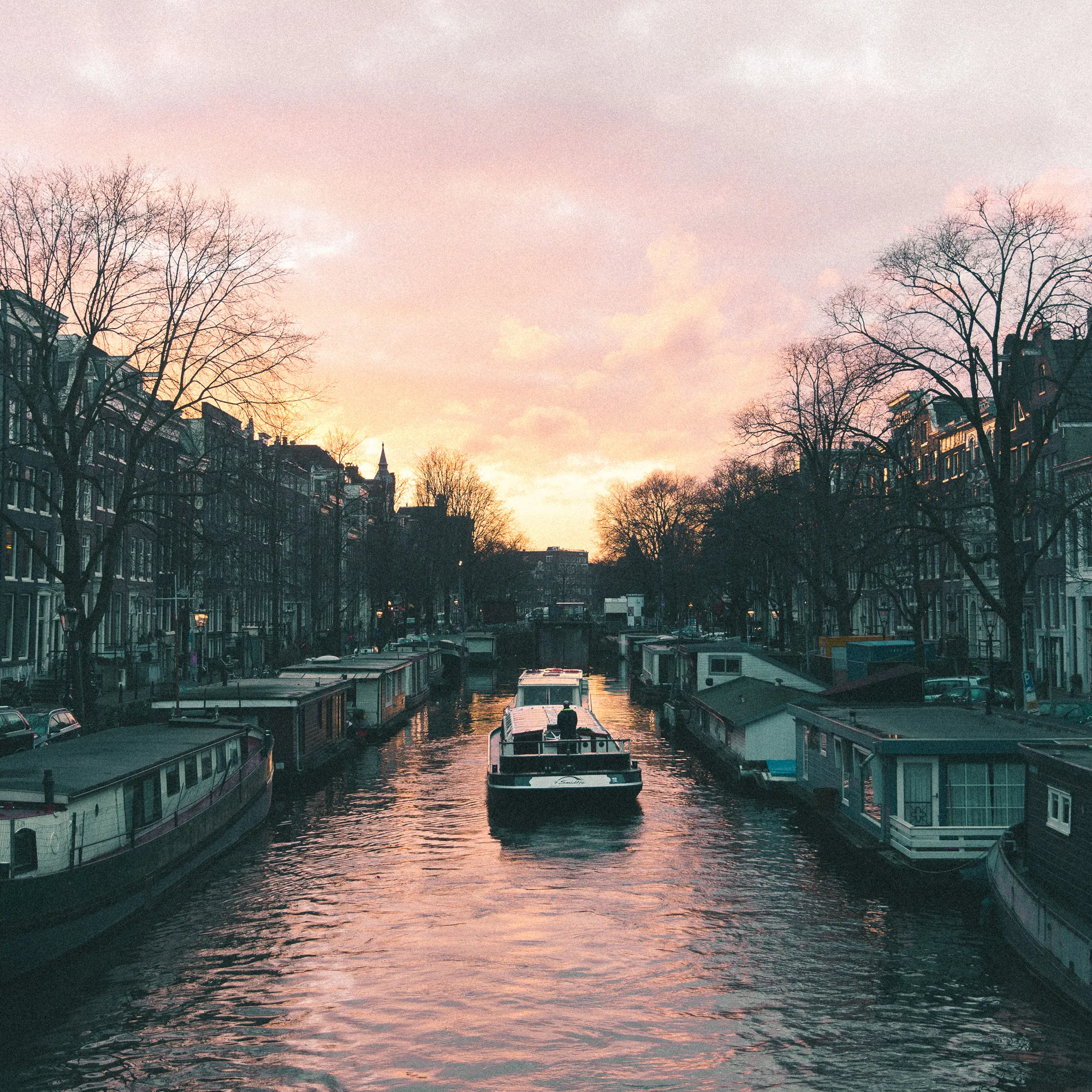 boating-amsterdams-canals-at-sunset.jpg