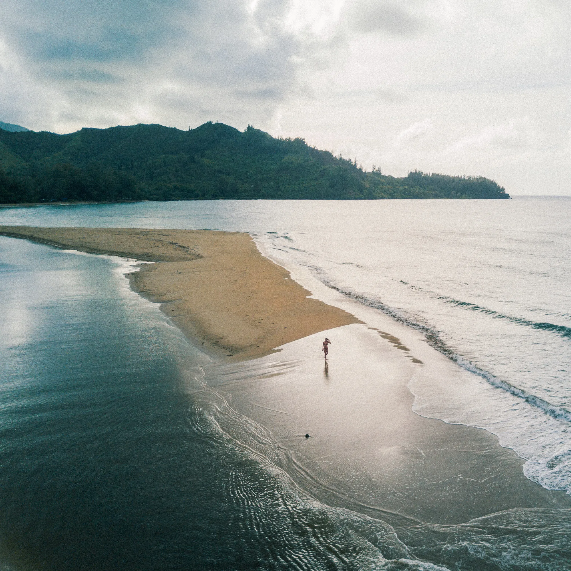 drone-shot-of-hanalei-bay-beach-in-kauai-hawaii.jpg