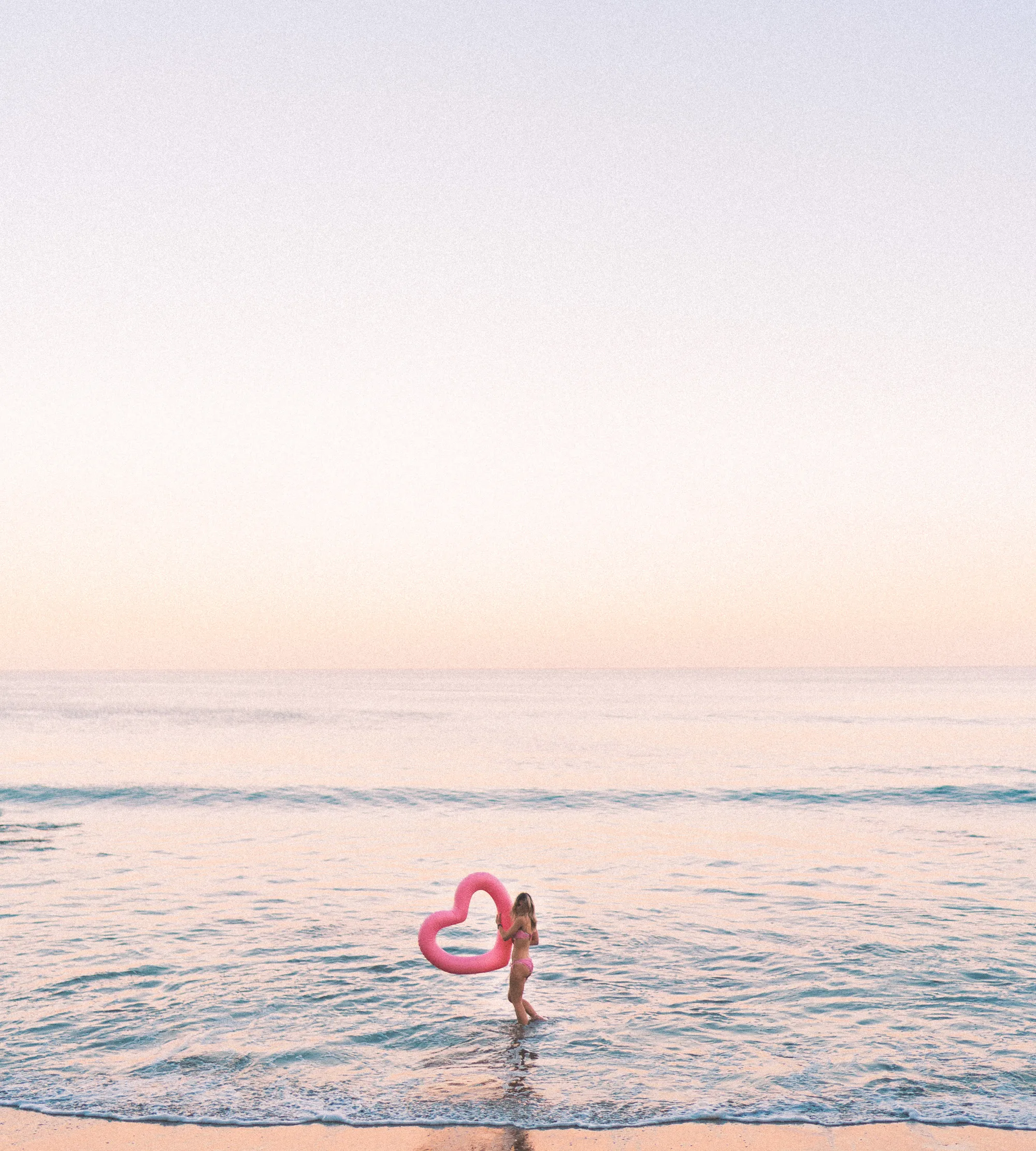 swimming-in-malibu-with-pink-heart-floatie.jpg